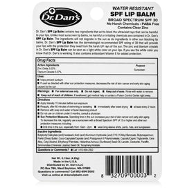Dr. Dan's lip balm next to a hand for size comparison and portable convenience