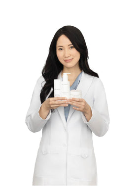Dr. Grace bottle next to a ruler to show compact travel-friendly size