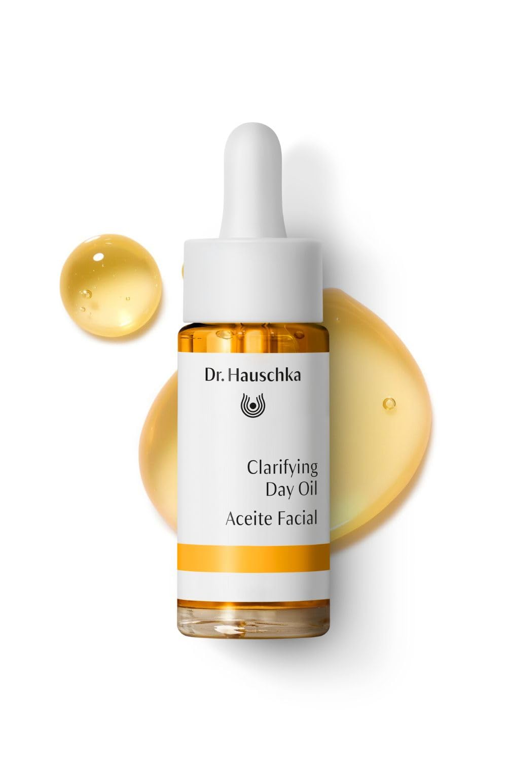 Dr. Hauschka dropper dispensing a clear drop, shows precise application benefit