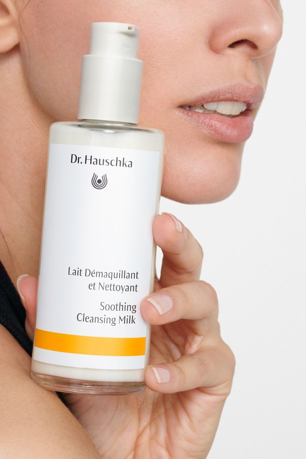 Dr. Hauschka cleanser dispensed on hand showing easy application