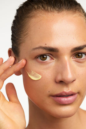 Dr. Hauschka applying cream to face and neck, provides lightweight daily hydration