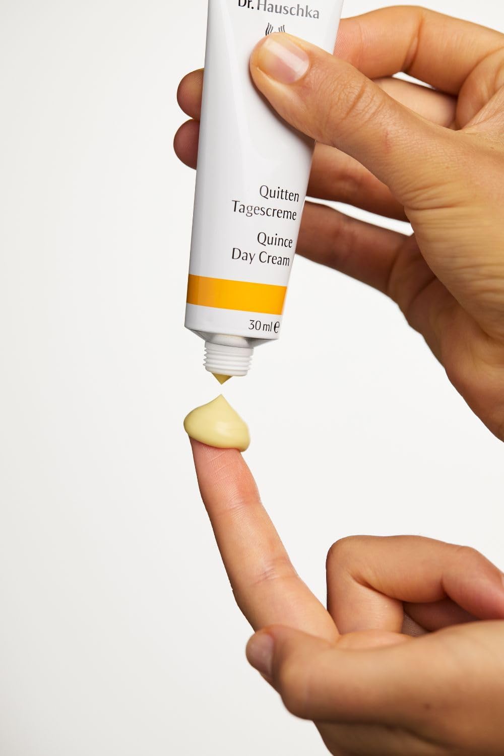 Dr. Hauschka jar on bathroom shelf in natural light, promotes refreshed morning routine