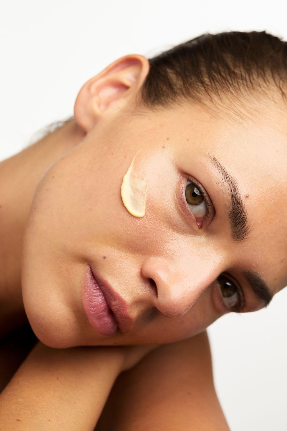 Dr. Hauschka jar beside common items showing 1.0 fl oz scale for travel convenience