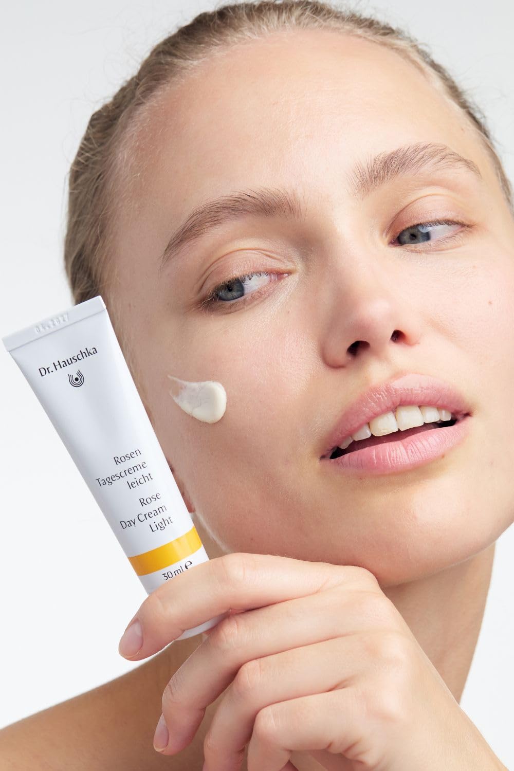Dr. Hauschka 1 fl oz size comparison displayed next to common items