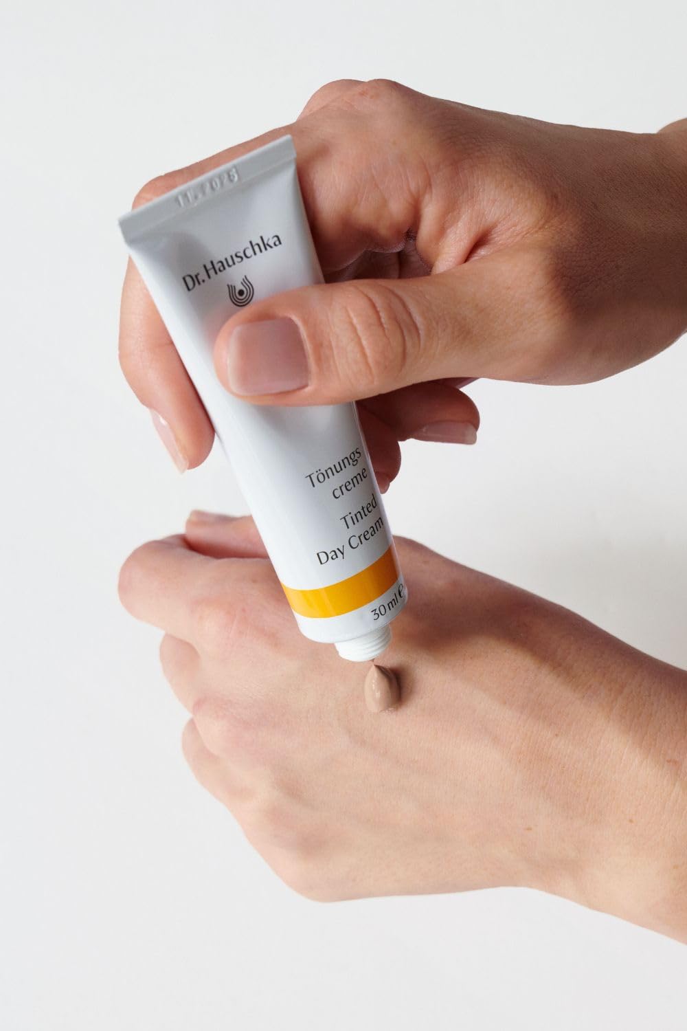 Dr. Hauschka cream staged with brushes showing quick morning routine benefit