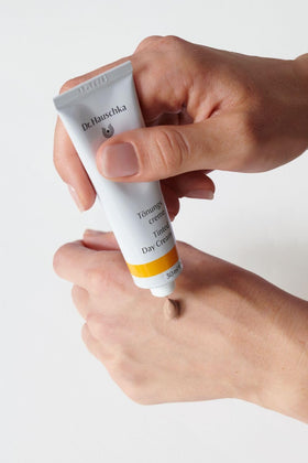 Dr. Hauschka cream staged with brushes showing quick morning routine benefit