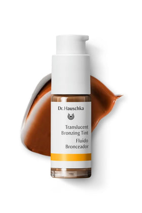 Dr. Hauschka bottle with cap off, drop of tint dispensing for precise use
