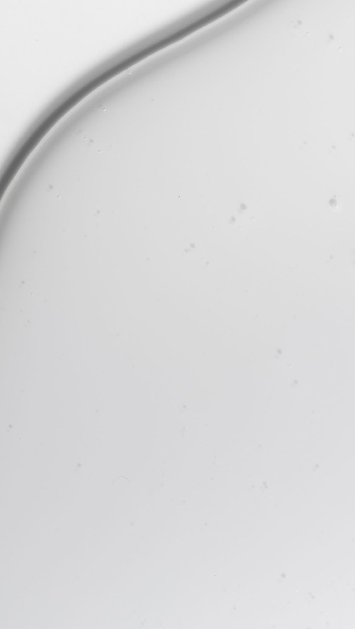 Dr. Loretta pump dispensing cleanser droplet for precise, mess-free application