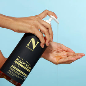 Dr. Natural next to common bottle for scale showing full 32 oz supply