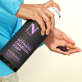 Dr. Natural hand squeezing soap to show easy application and cleansing