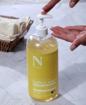 Dr. Natural being used to bathe a dog demonstrating pet-safe dilution and gentle cleansing benefit