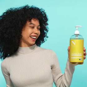 Dr. Natural diluted in bowl for shampoo showing clear dilution method and hair clarification benefit