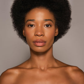 Dr. PAWPAW ORIGINAL BALM applied to lips demonstrating hydration and smoothing benefit