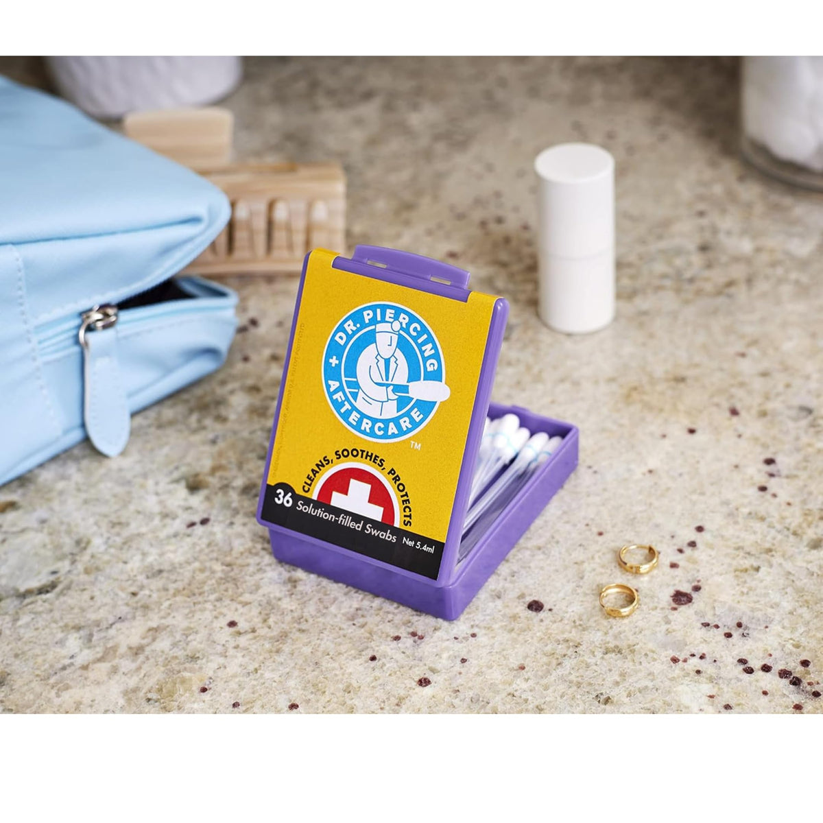 Dr. Piercing Aftercare blue break line on swab indicating quick snap-and-use benefit