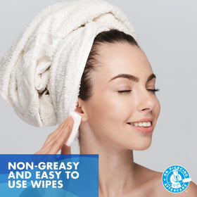 Dr. Piercing Aftercare wipe next to a phone for pocket-size scale and convenience