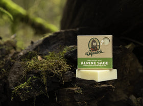 Dr. Squatch Alpine Sage placed on shower shelf demonstrating drainage benefit