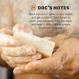 Three Dr. Squatch bars on a draining soap dish to extend lifespan and prevent sogginess