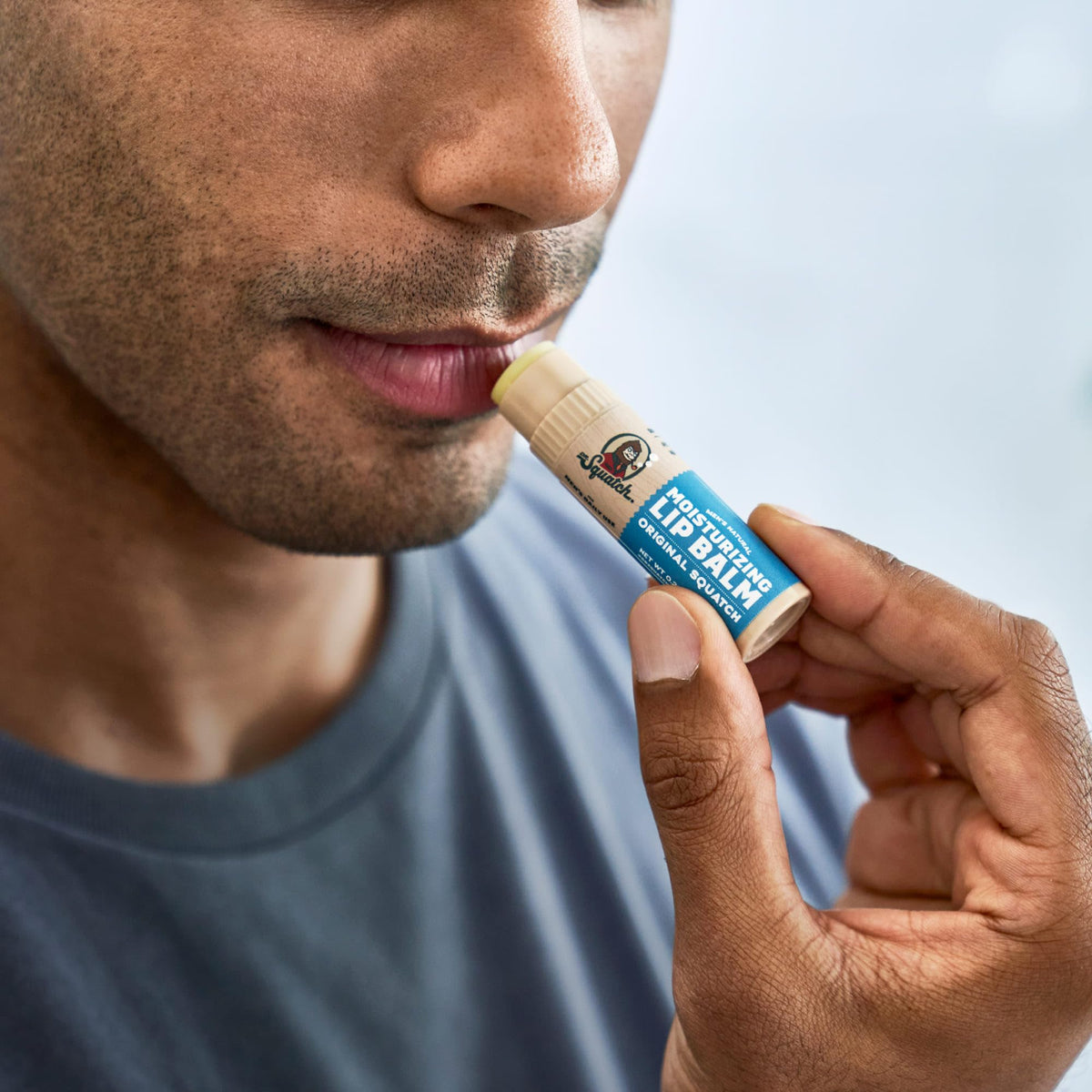 Dr. Squatch Coconut Cove tube in beach setting evoking tropical hydration