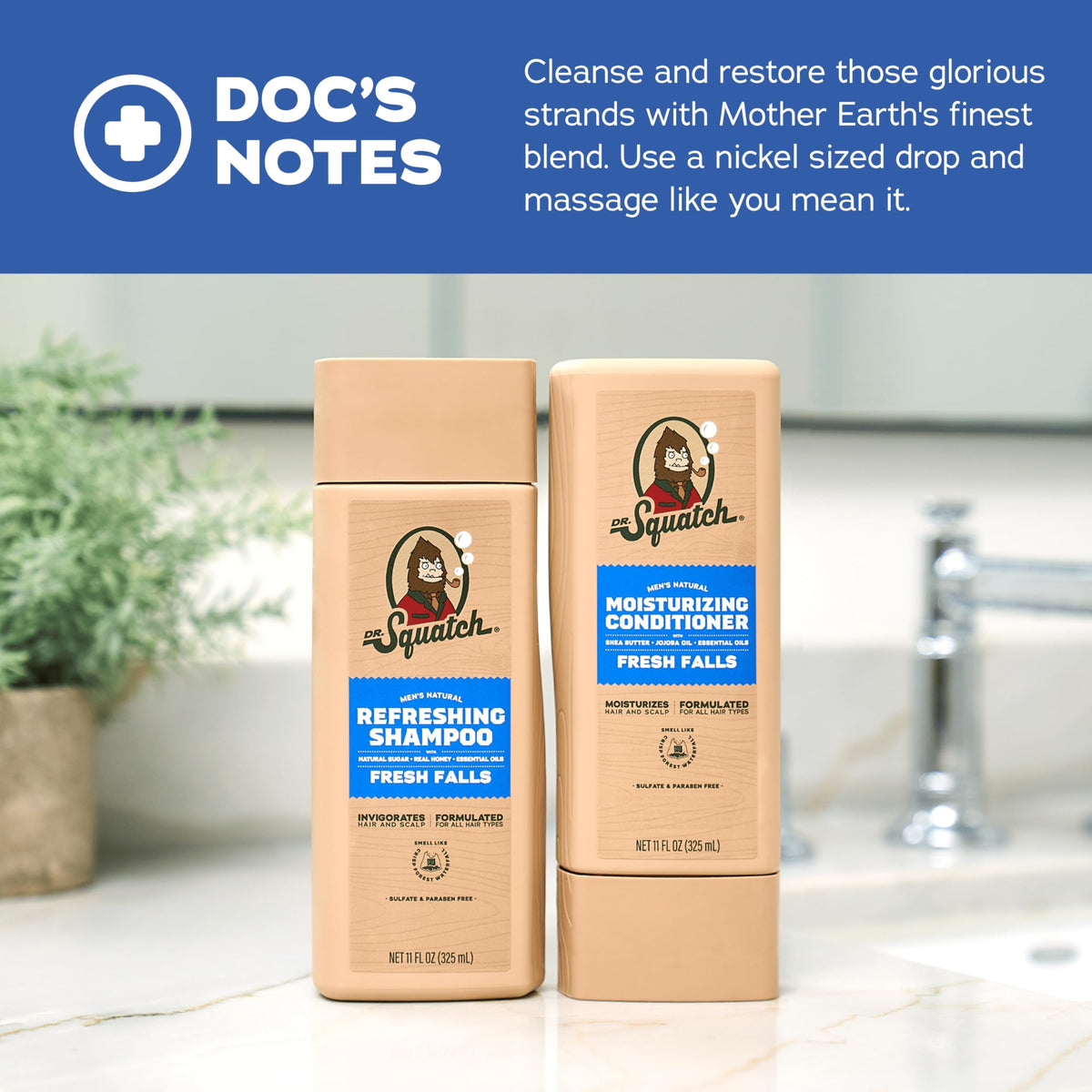 Two 11 fl oz Dr. Squatch Fresh Falls bottles beside a hand for size scale and travel convenience