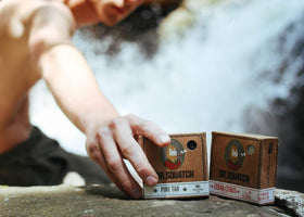 ingredient label on Dr. Squatch bar listing coconut, olive, and organic oils
