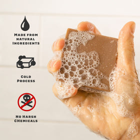Dr. Squatch pine tar bar texture detail highlighting deep woodsy fragrance benefit