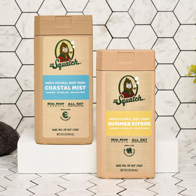 Dr. Squatch 14 oz bottle held in hand showing portable daily size