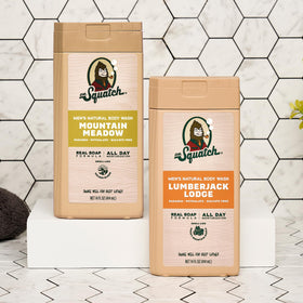 Dr. Squatch 14 oz bottle next to a hand showing true product scale