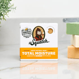 Dr. Squatch bar producing creamy lather in hand to demonstrate gentle cleansing action