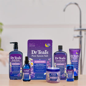 Dr Teal's 24 fl oz bottle held to show true size and scale