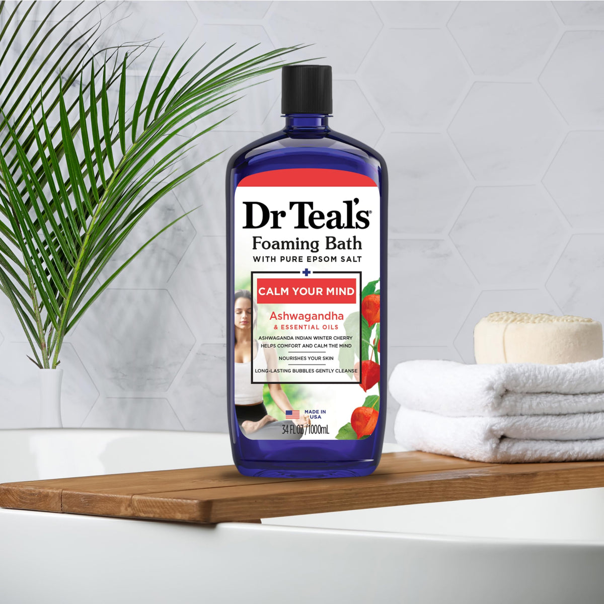 Dr Teal's bottle beside a common object to show 34 fl oz scale