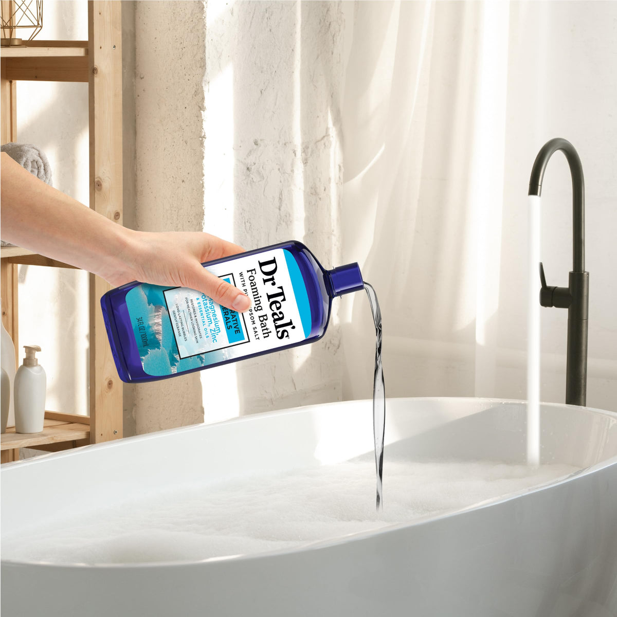 Dr Teal's bottle beside Epsom salt jar showing mineral focus