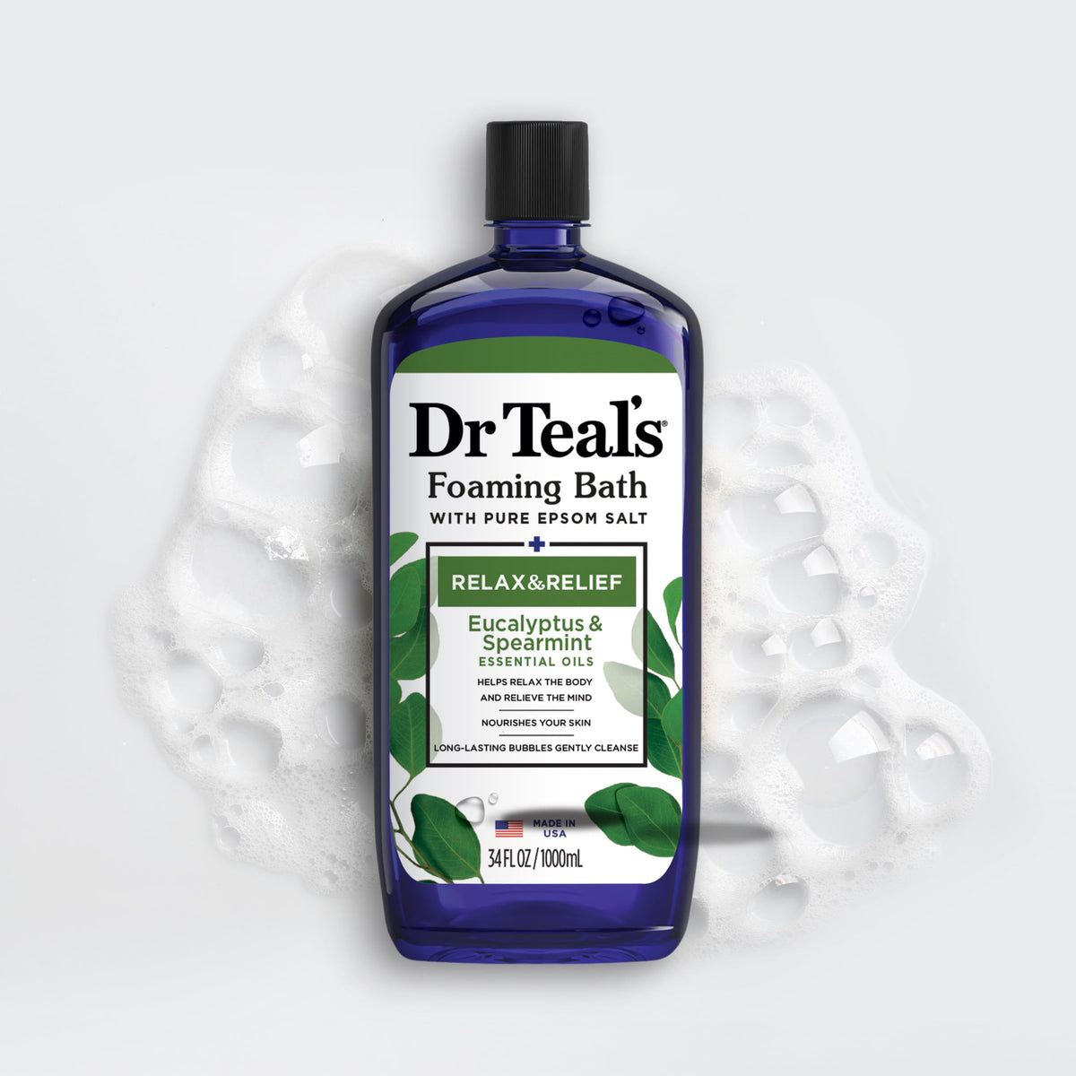 Eucalyptus and spearmint botanicals near Dr Teal's bottle highlighting refreshing scent