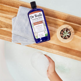 Dr Teal's label close-up showing ingredients like Epsom salt and coconut oil benefit