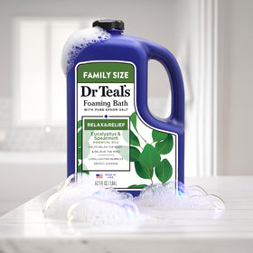Dr Teal's product being poured into water showing foam creation for a calming bath ritual