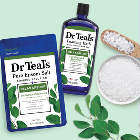 Dr Teal's salt granules in hand illustrating texture and dissolving ease
