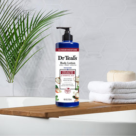 Dr Teal's 18 fl oz bottle next to a ruler showing travel and size convenience benefit