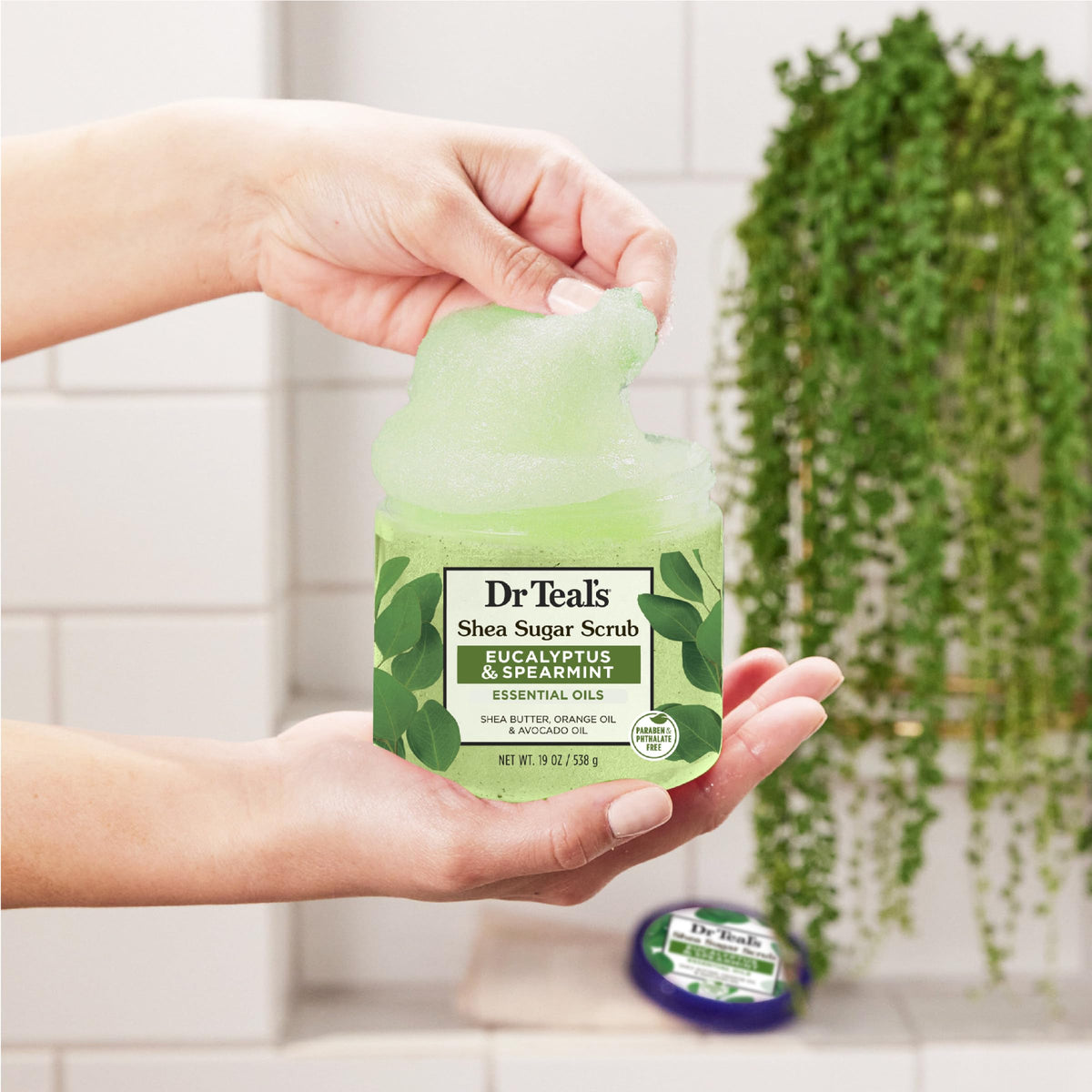Dr Teal's scrub placed in a bathroom setting implying relaxation and refreshment