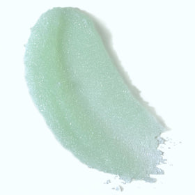 Dr Teal's scrub on wooden spoon displaying grain and blend benefit