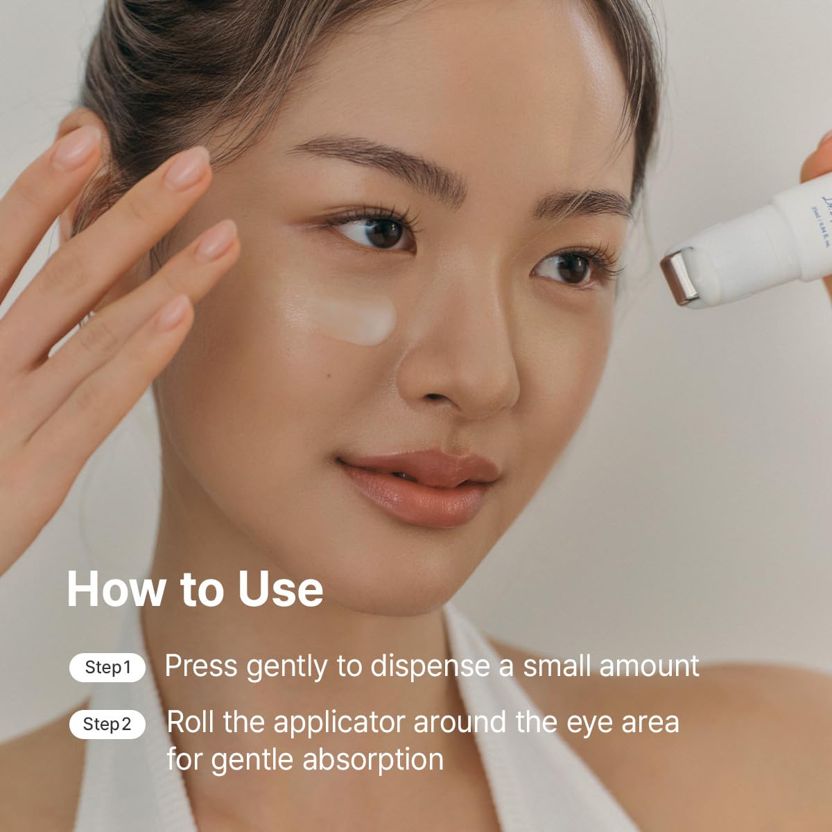 Dr.Althea eye roller beside coin to show compact size