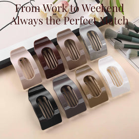 Drealoe clip securing a low bun outdoors for stable, no-slip styling