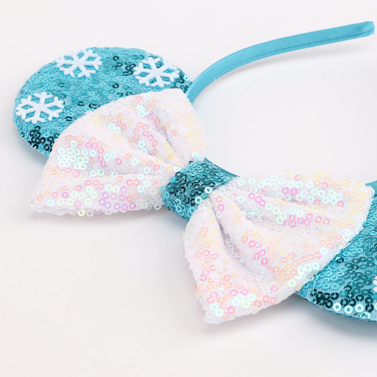 DRESHOW close-up of sequin bow highlighting sparkle and visual impact