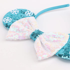 DRESHOW close-up of sequin bow highlighting sparkle and visual impact