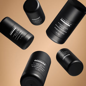 DRMTLGY hydra stick application on face showing quick reapplication and clear coverage