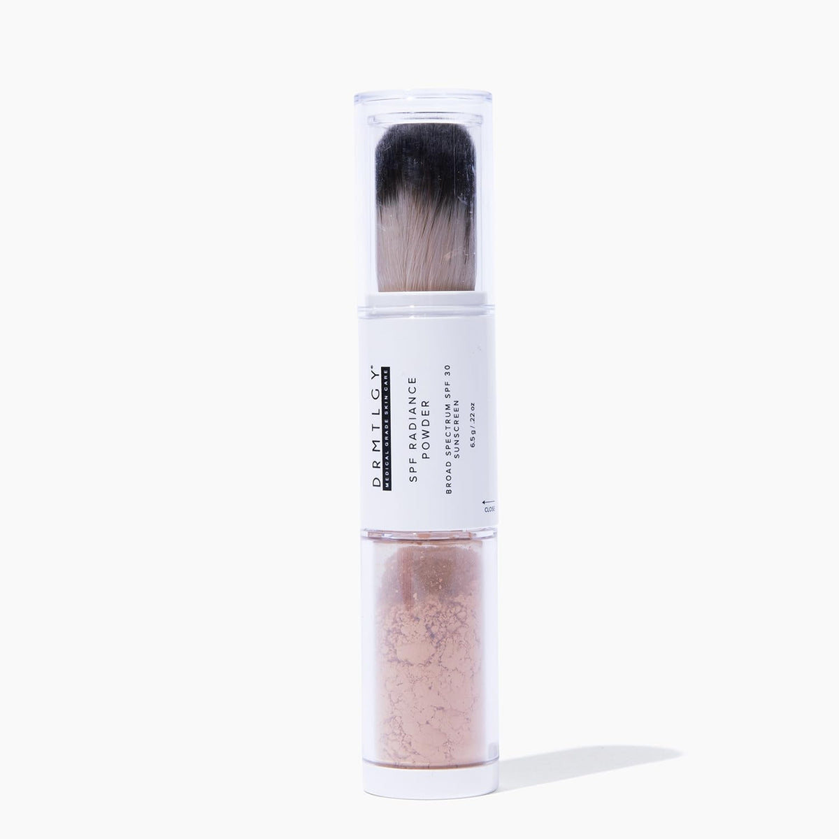 DRMTLGY powder front packaging showing compact brush and label with SPF benefit