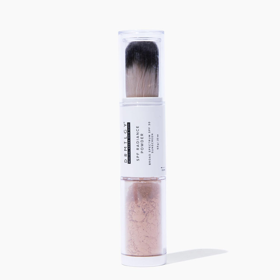 DRMTLGY powder front packaging showing compact brush and label with SPF benefit
