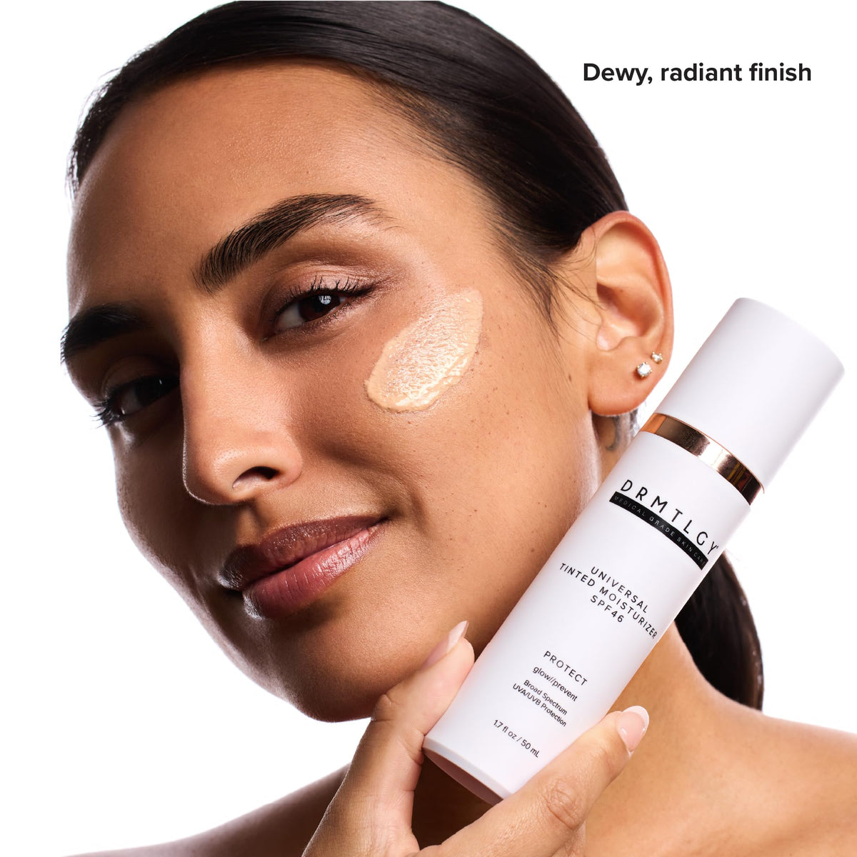 DRMTLGY applying tinted moisturizer on hand to show blendability and coverage