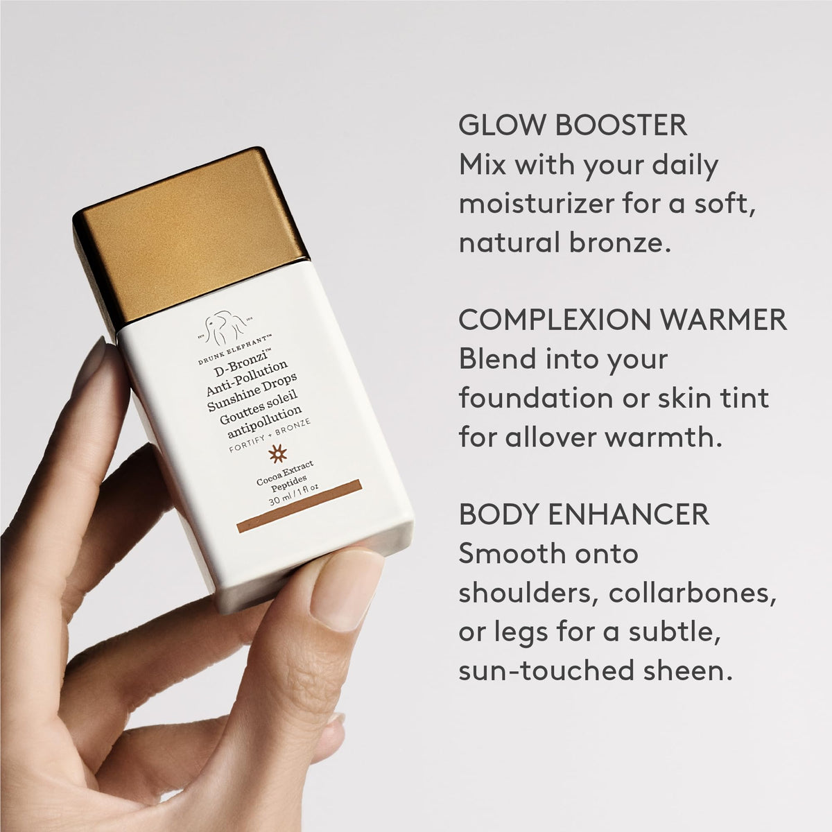 D-Bronzi bottle held in hand showing size and portability benefit