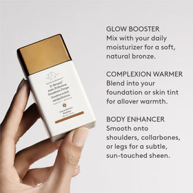 D-Bronzi bottle held in hand showing size and portability benefit