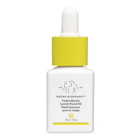 Drunk Elephant bottle front packaging showing compact 15 ml size and benefit