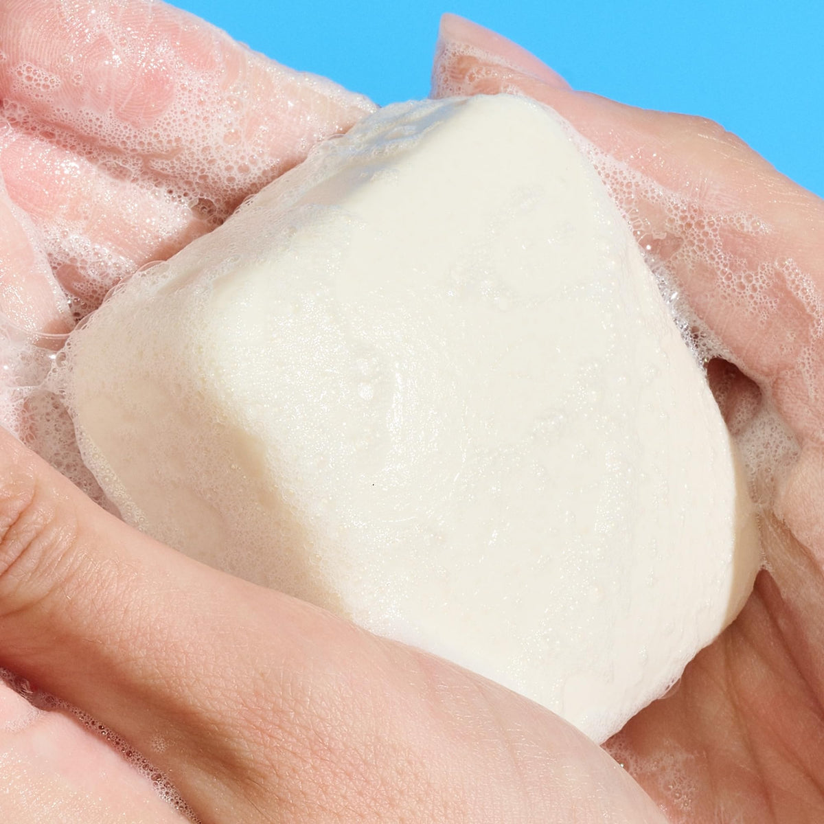 Drunk Elephant Pekee Bar close-up texture shot showing creamy surface and nourishing oils